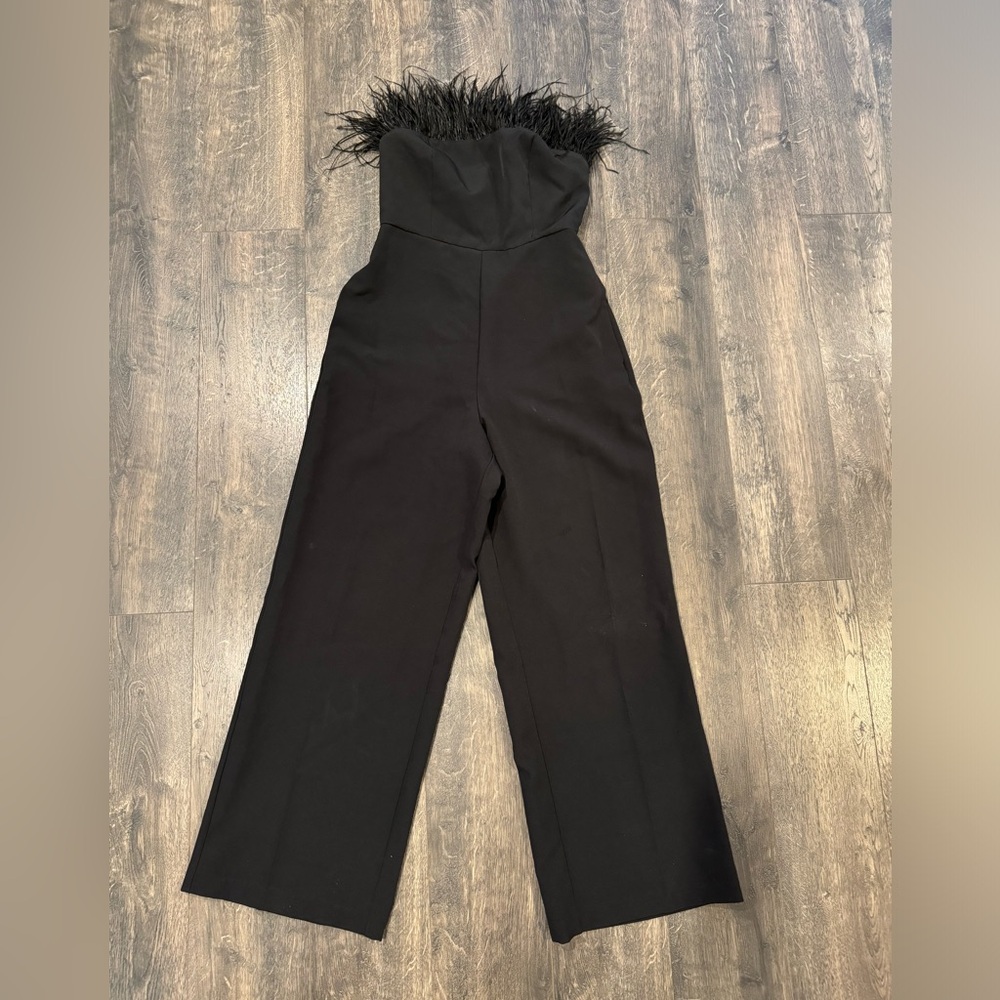 Cute black jumpsuit with feather detail